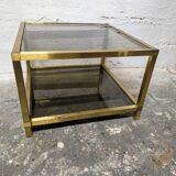 Table basse en métal doré et verre fumé