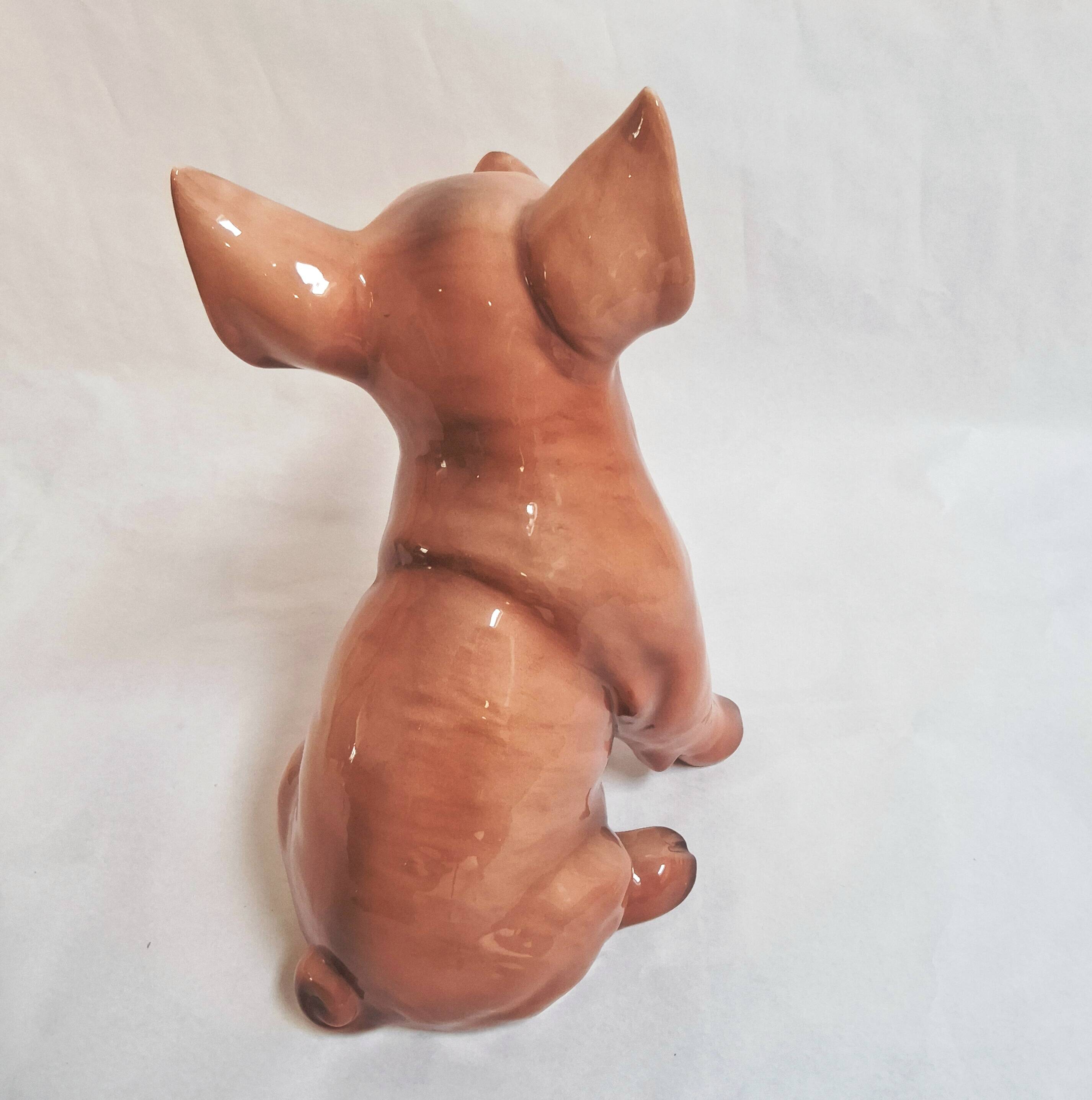 Beautiful, handcrafted porcelain figurine of a piglet, made by Capodimon.