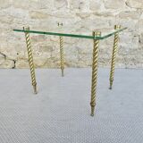 End of sofa, glass and twisted legs in gilded metal