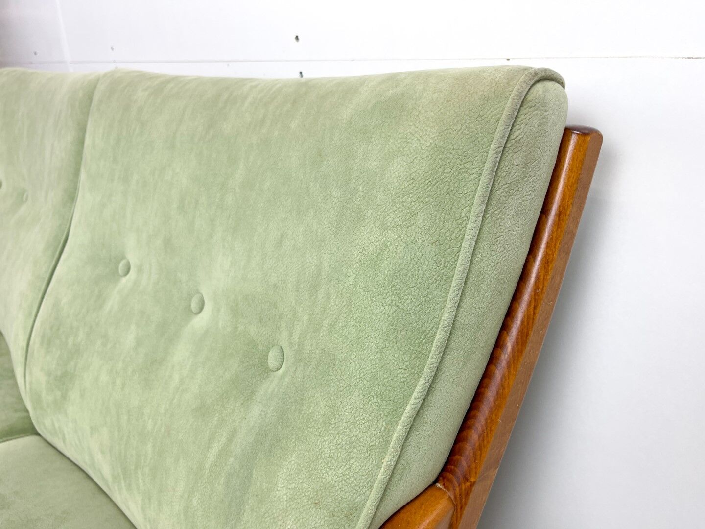 Two-seater sofa from the sixties with green upholstery