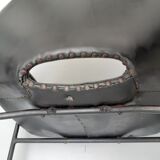 Pair of armchairs, Tonneau model, in black skai by Pierre Guariche, 60s