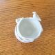 Antique porcelain egg cup/salt shaker duo