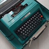 Studio 45 with his suitcase olivetti typewriter