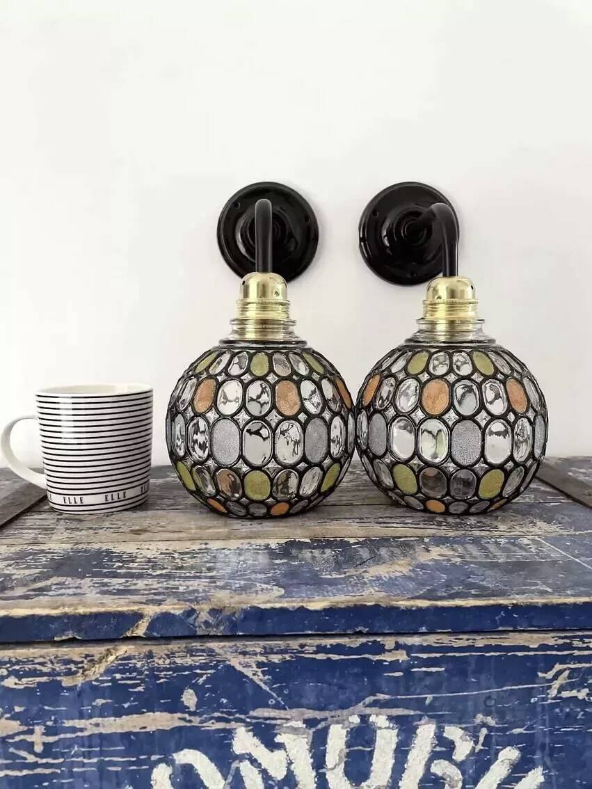 Pair of faceted glass globe wall lights