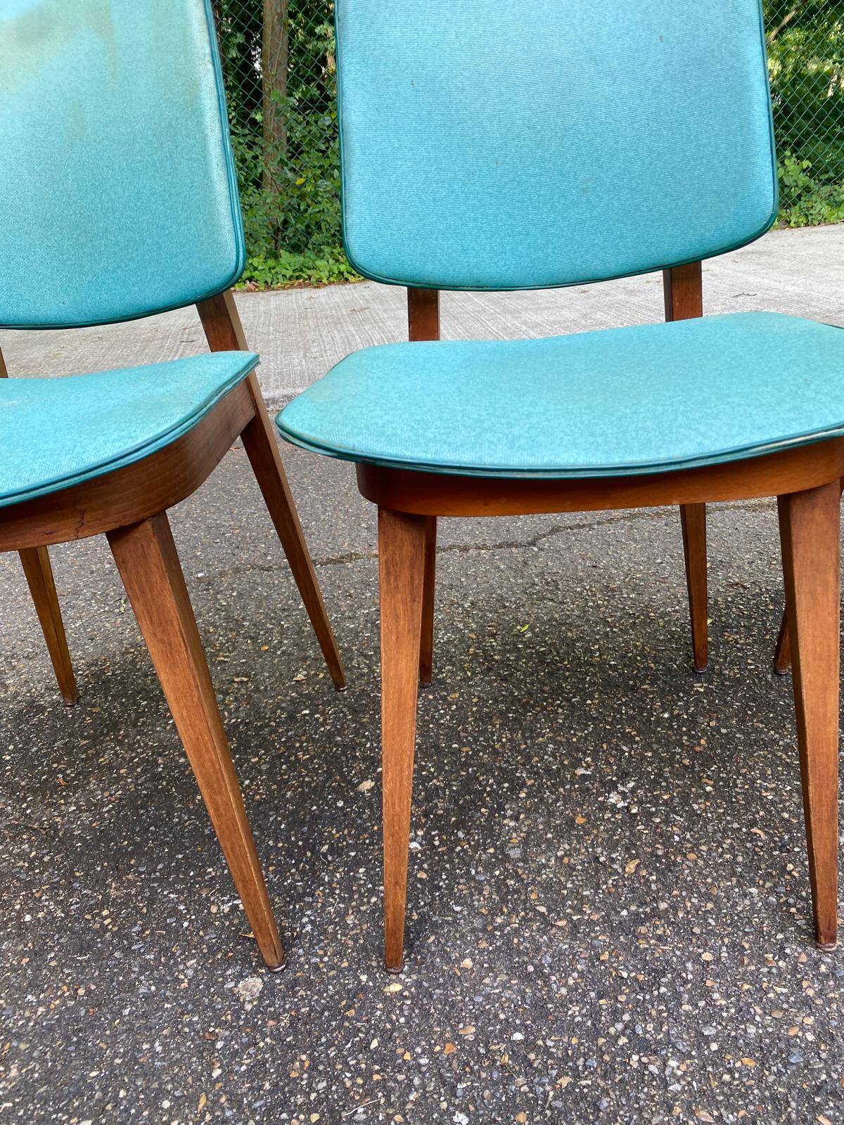 4 Scandinavian dining chairs in solid wood and blue-green leather from the 1950s.