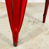 Set of four low chairs in red steel