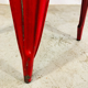 Ensemble de quatre chaises basses en acier rouge