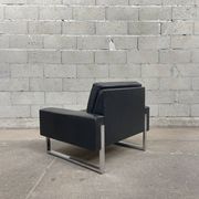 Pair of black leather armchairs