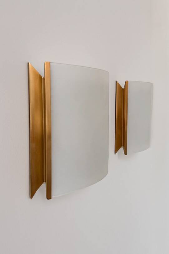Pair of vintage brass and curved glass wall lights, France, 1970.