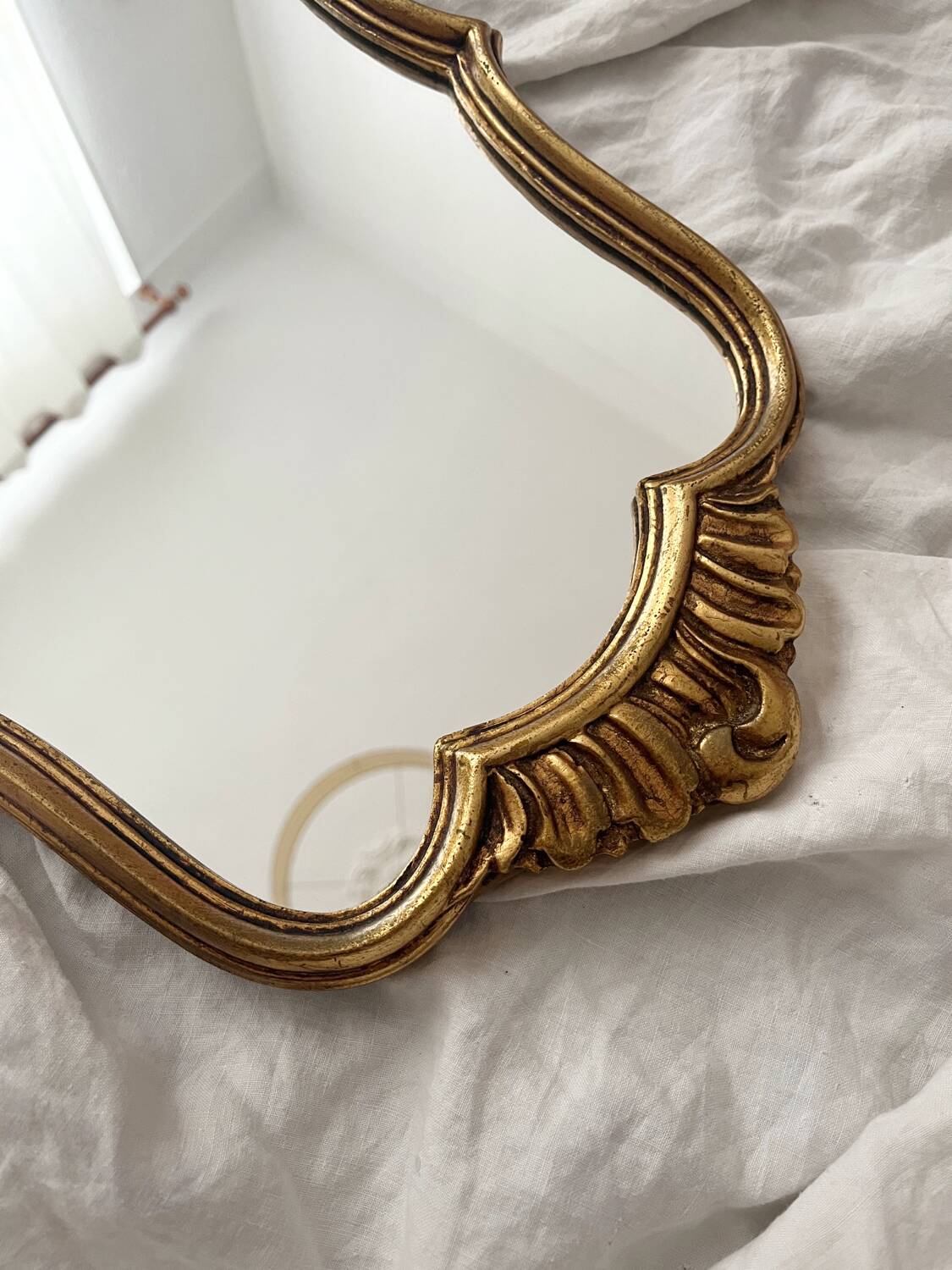 Antique Louis XV gilded mirror with vintage rocaille shell