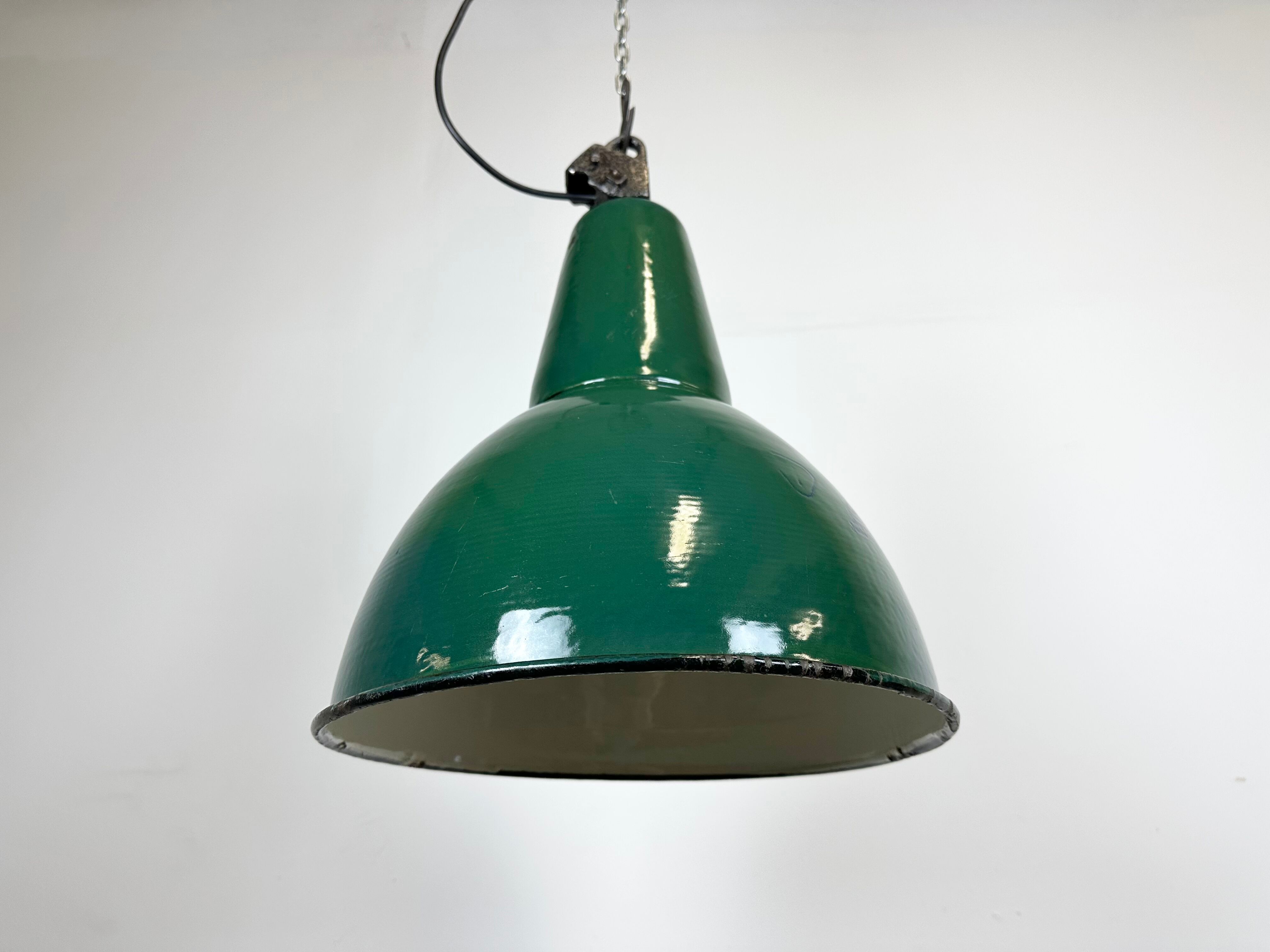 Industrial green enamel factory lamp with cast iron top, 1960s