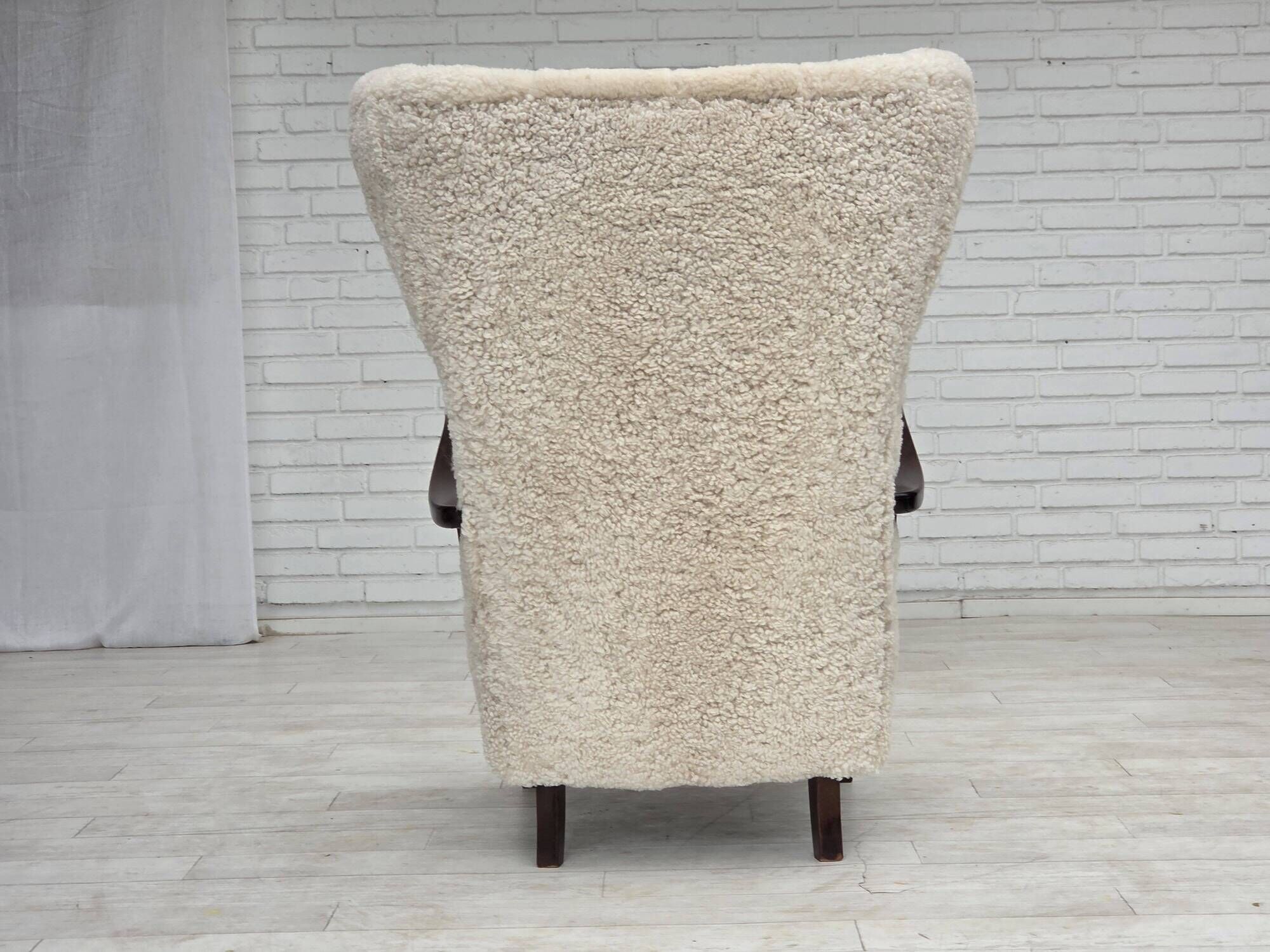 1960s, Danish high-back armchair, genuine sheepskin, reupholstered.
