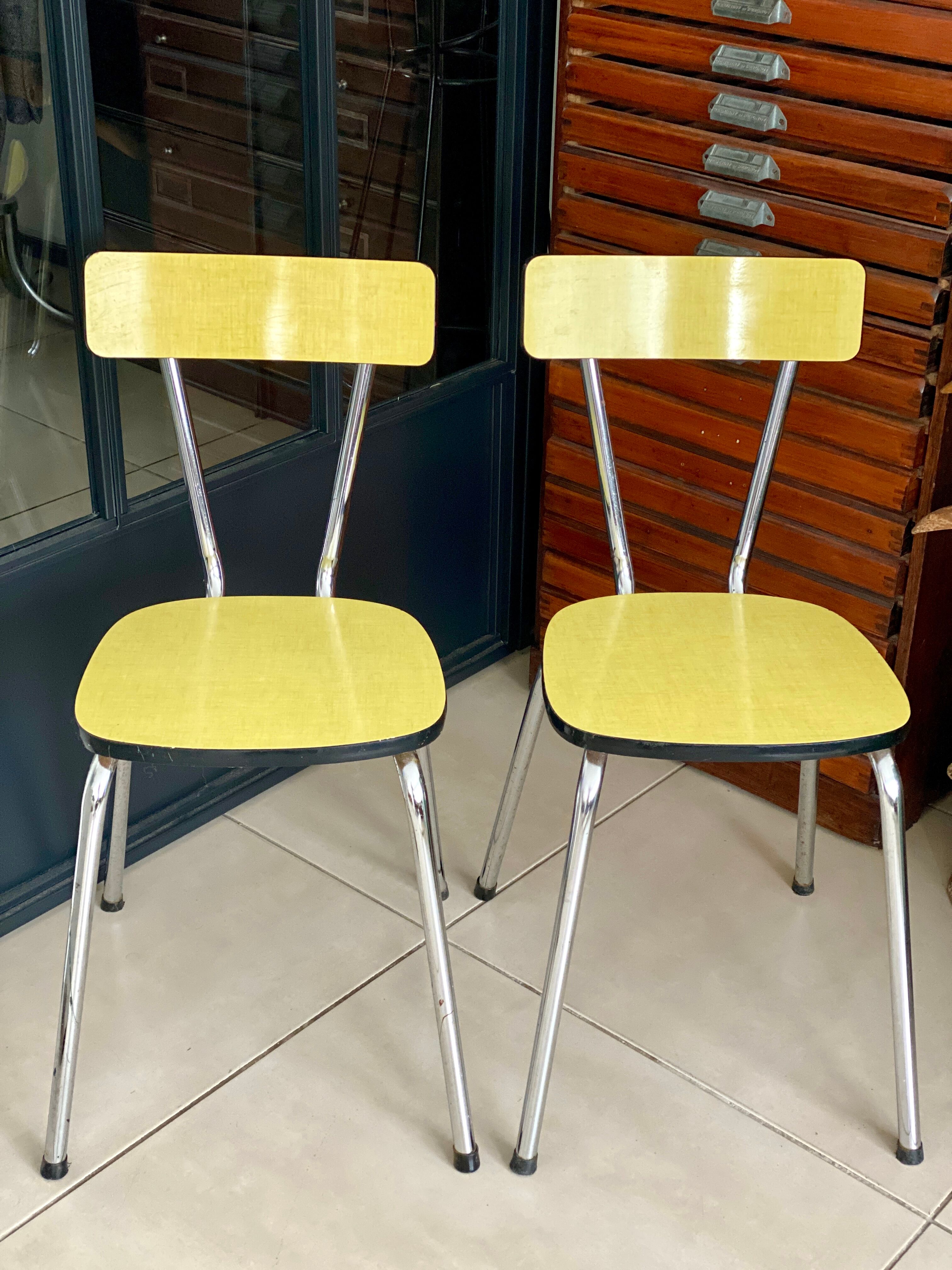 Pair of yellow formica chairs