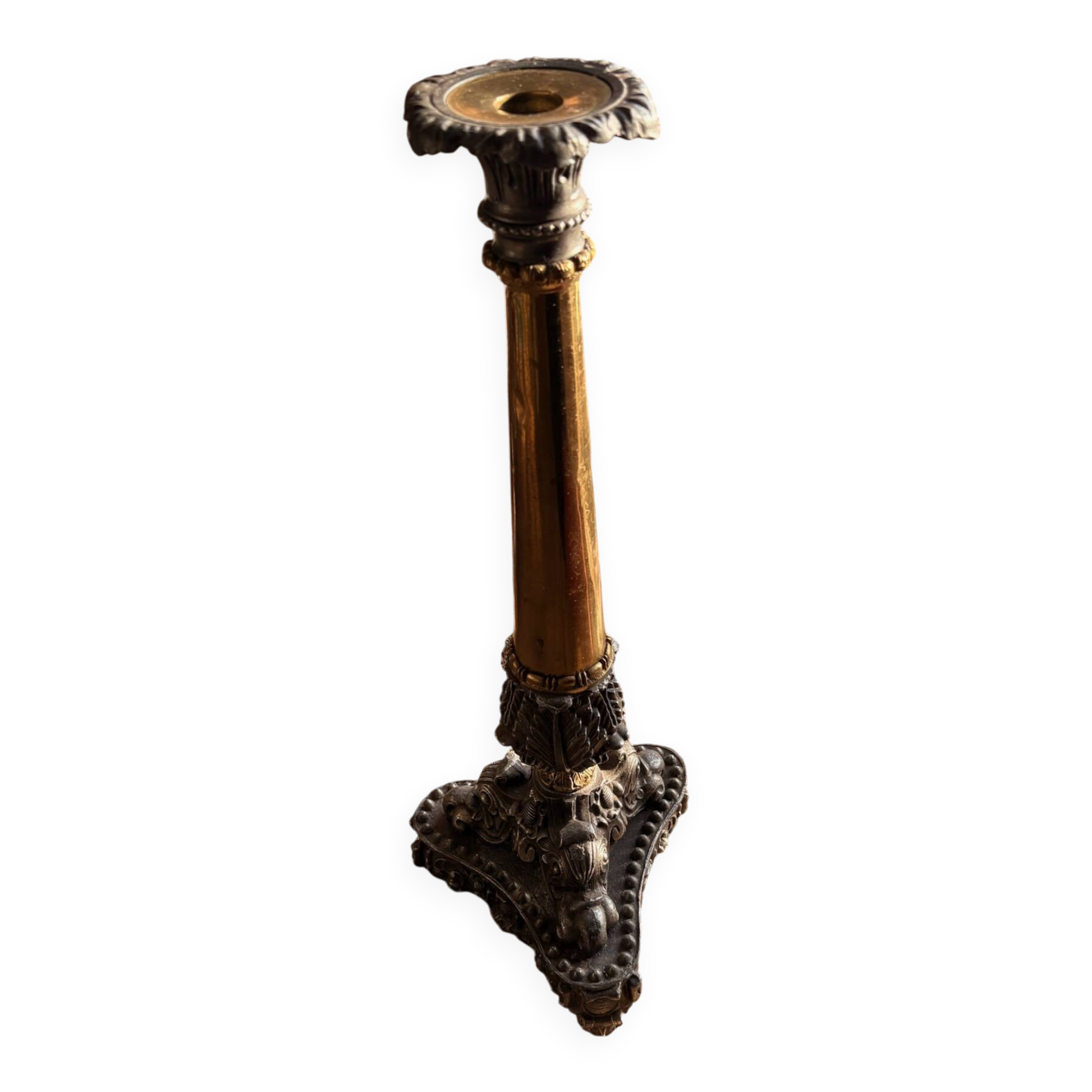 Empire candlestick in gilded and patinated bronze, decorated with acanthus leaves and griffins.