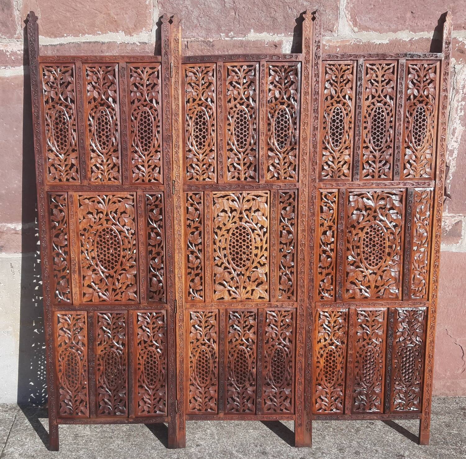 Carved solid wood screen.