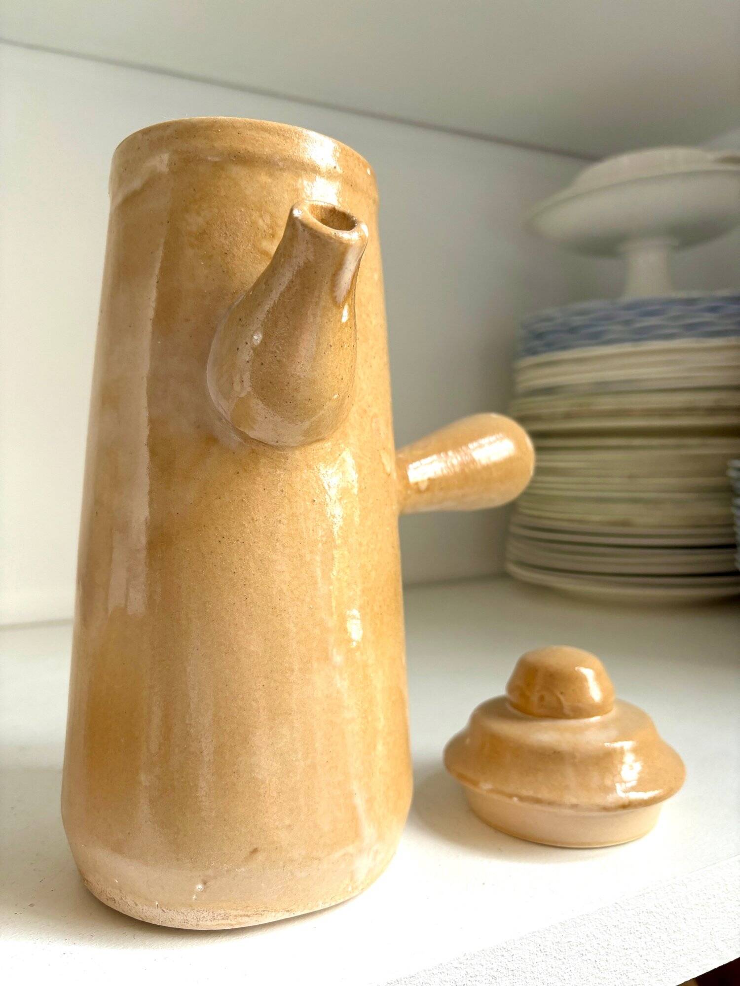 Beige enameled stoneware teapot