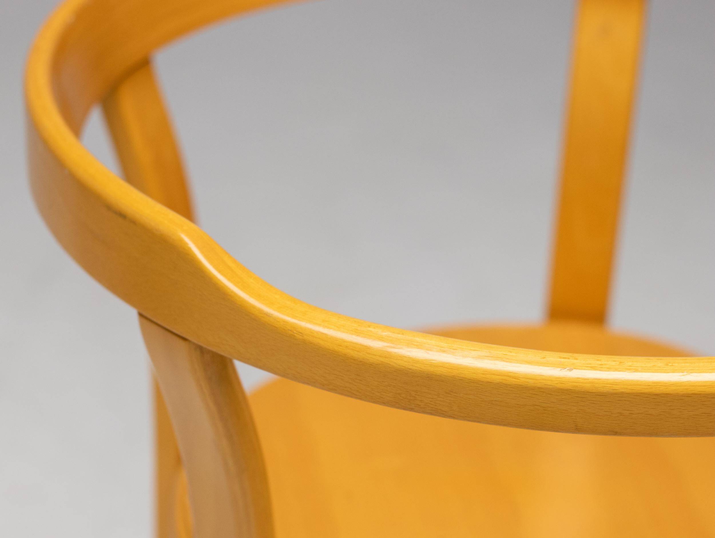 Stackable chairs in curved beech.