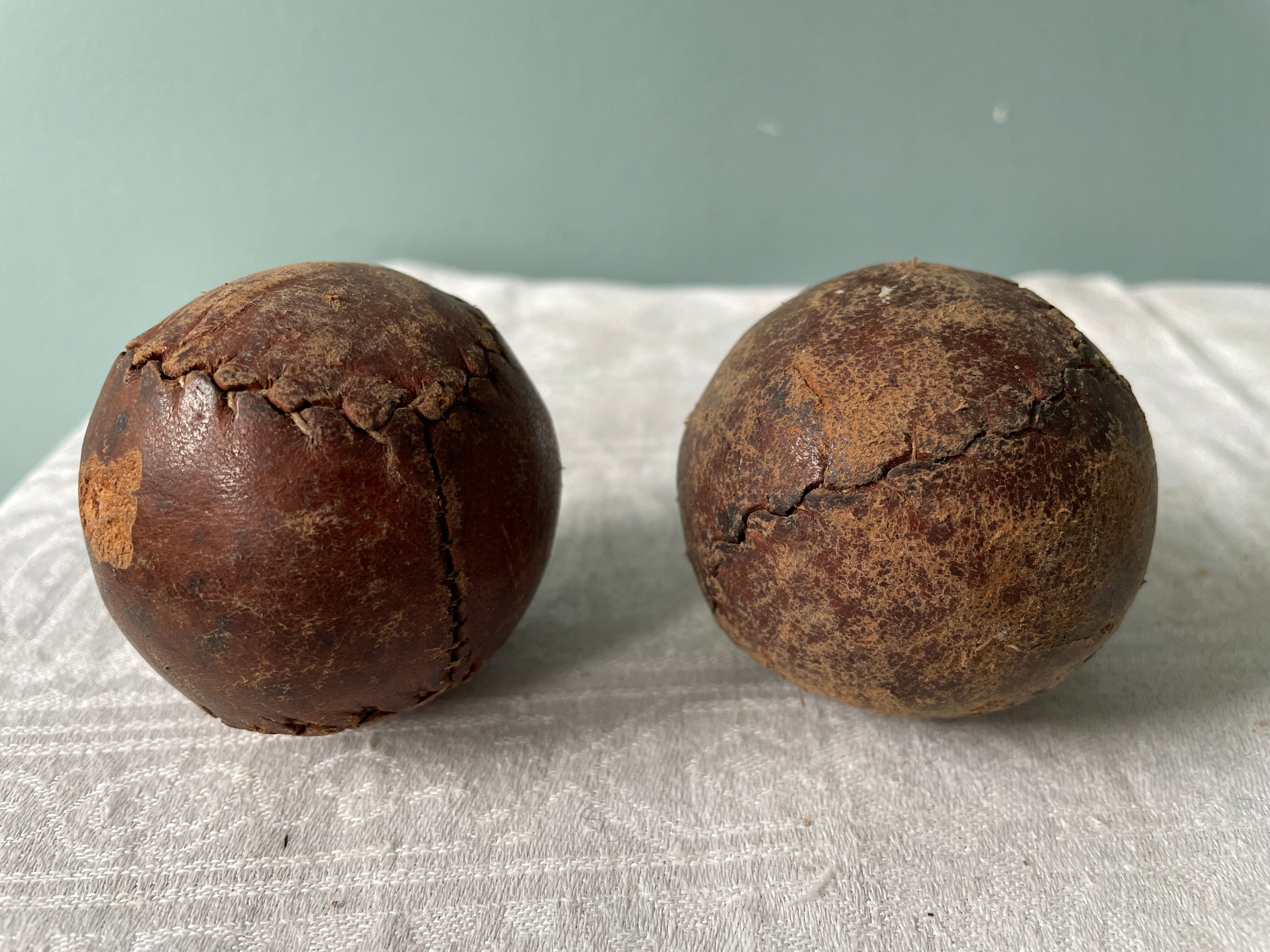 Two old nineteenth century leather golf balls