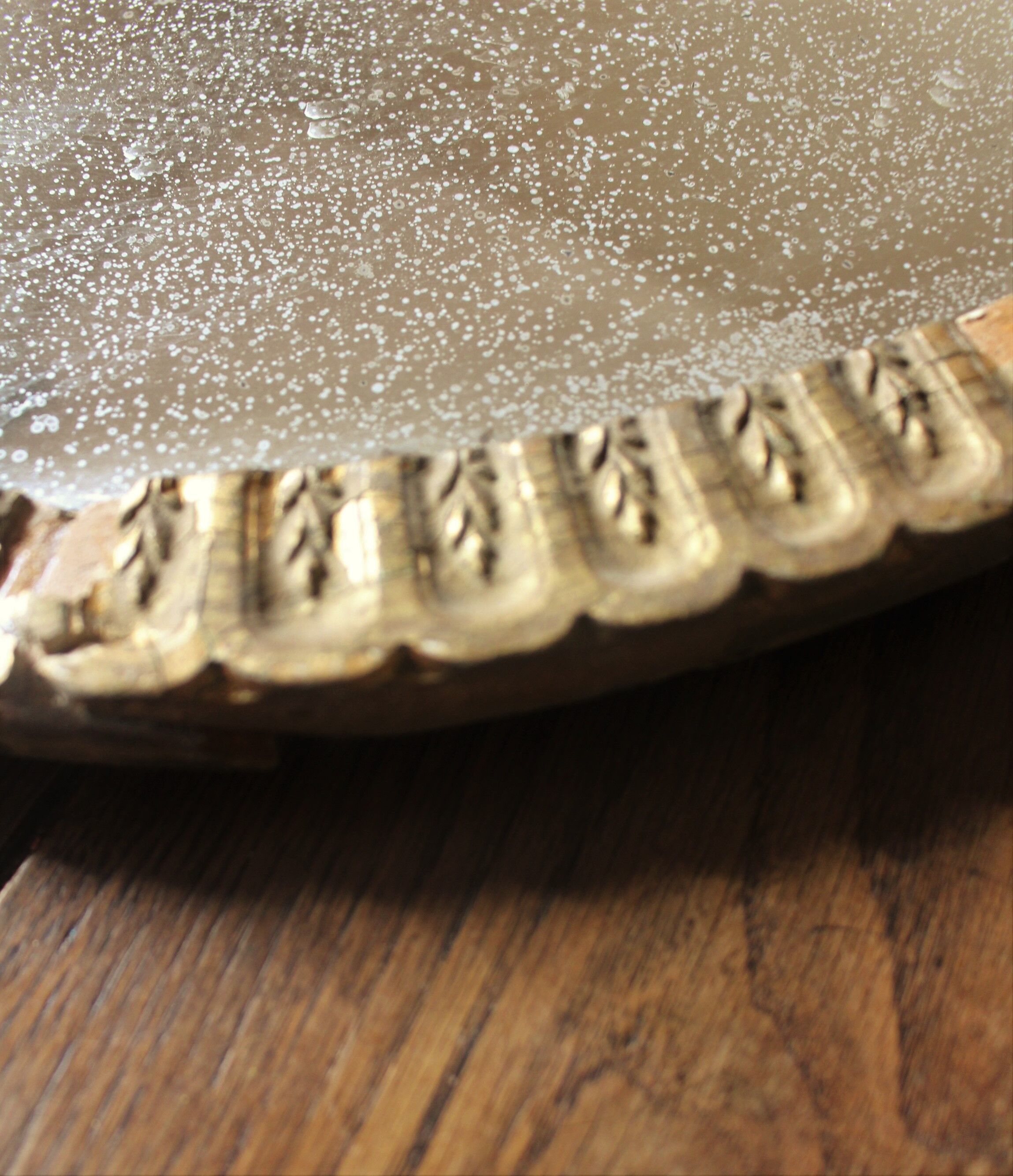 Old oval mirror gilded wood mercurized