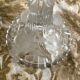 Pair of moulded glass candlesticks, ram heads and masks