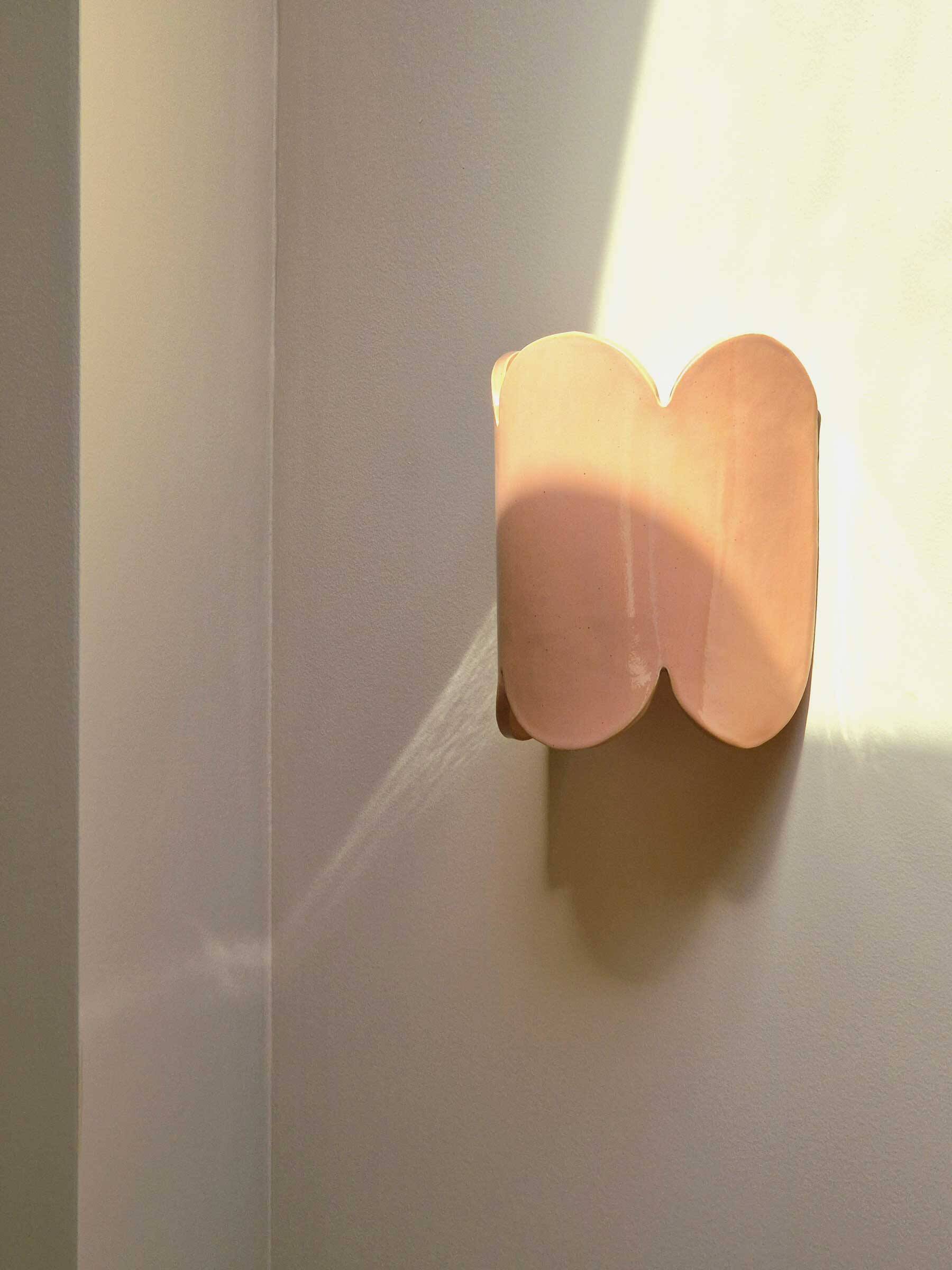 Mocha enamelled stoneware wall light (small model).