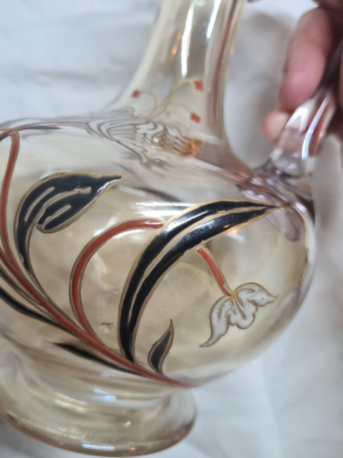 Large Art Nouveau carafe with iridescent enamelled glass and flowers.