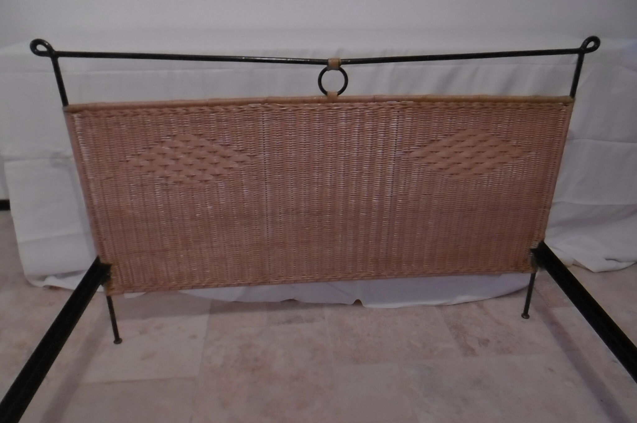 Black metal and rattan bed frame