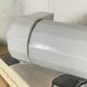 Art Deco tubular wall light in ceramic and white opaline glass tube.