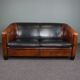 2.5-seater art deco style sofa in sheepskin