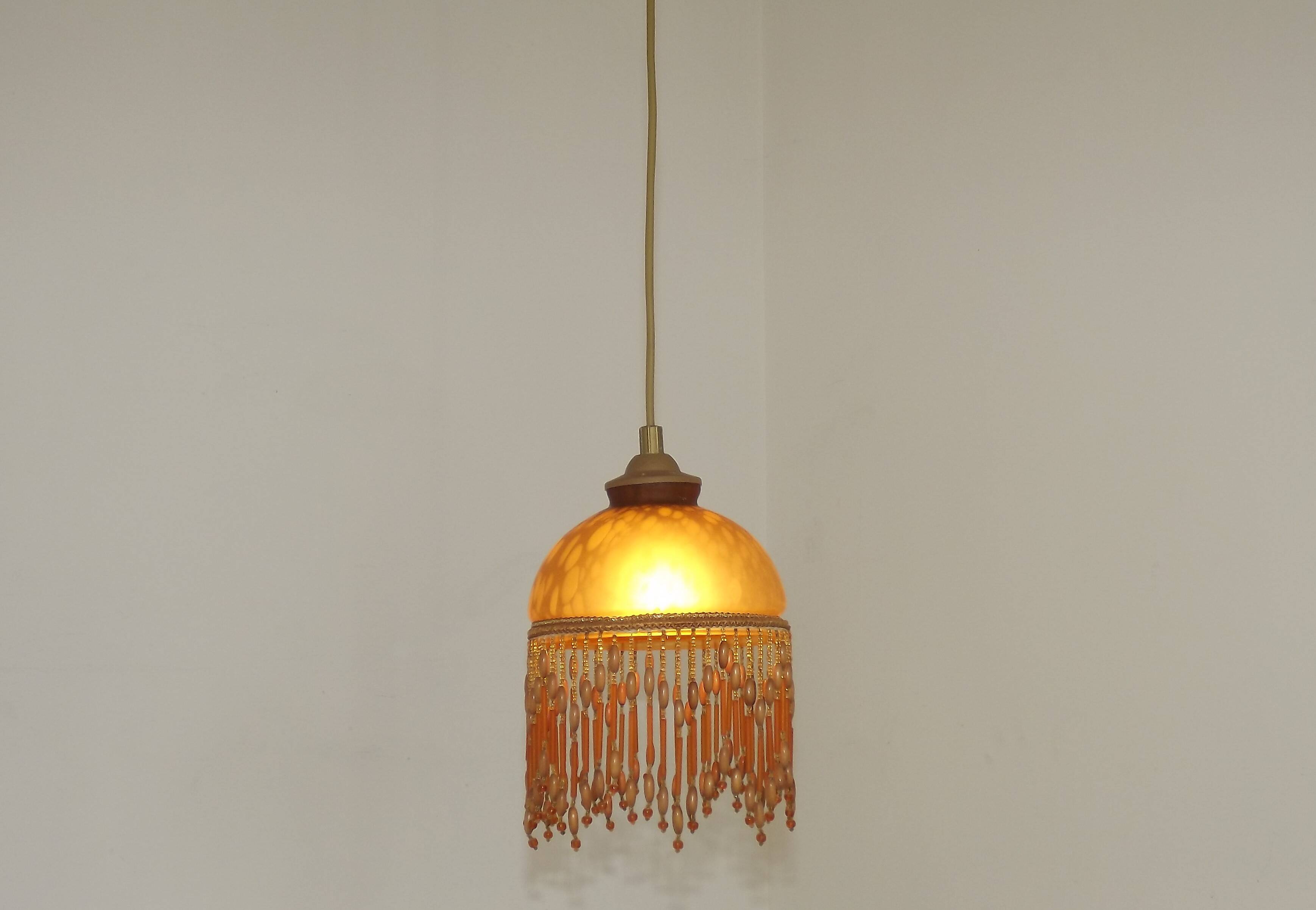 Vintage French amber mottled glass hanging ceiling light with beaded fringe.