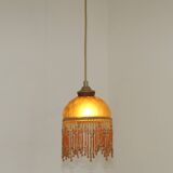 Vintage French amber mottled glass hanging ceiling light with beaded fringe.