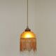 Vintage French amber mottled glass hanging ceiling light with beaded fringe.