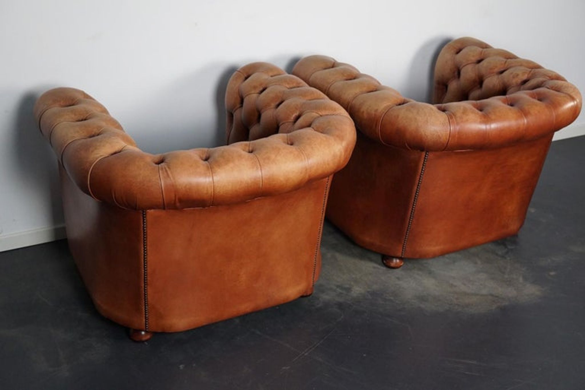 Set of 2 vintage chesterfield club armchairs in cognac leather, Netherlands,