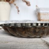 Large vintage shell-shaped platter in shiny silver-plated metal.