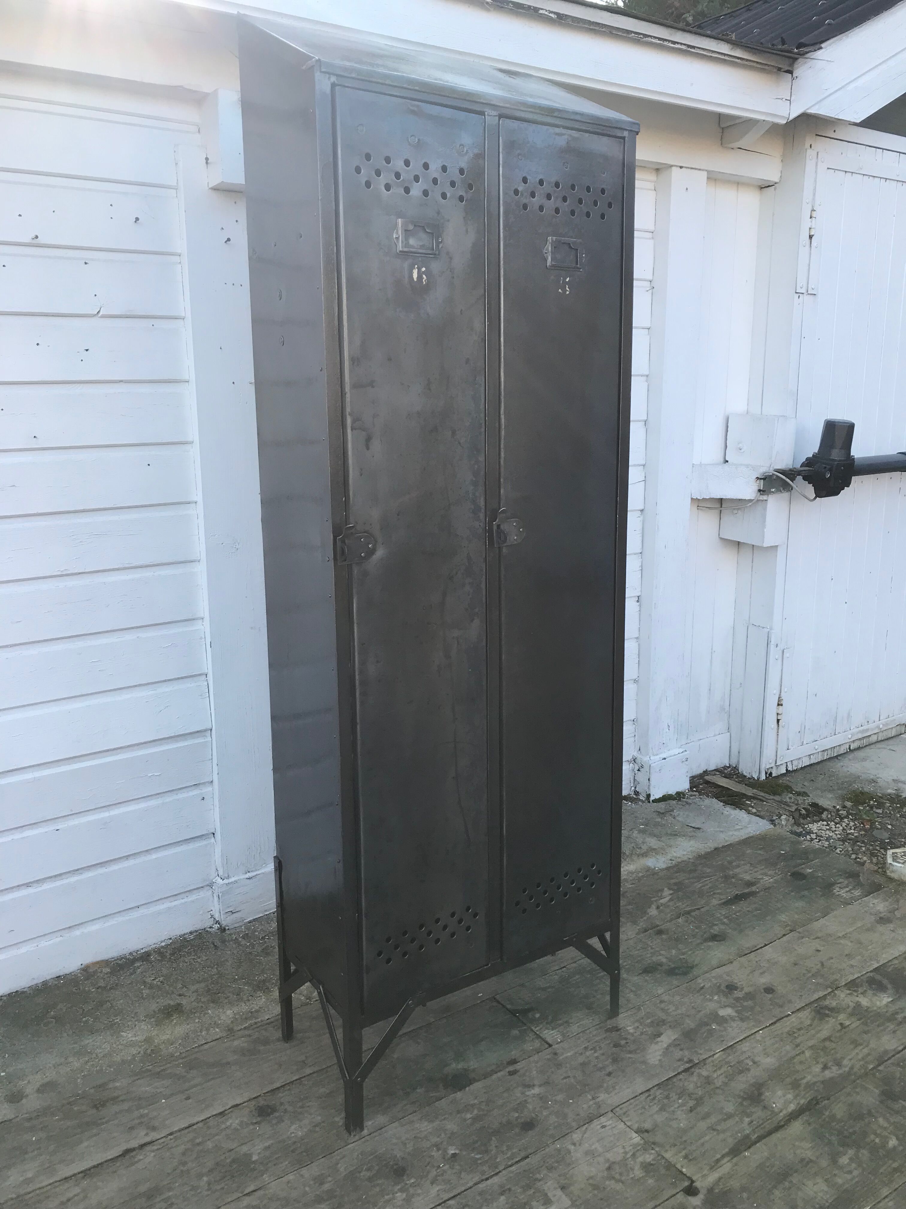 Antique riveted metal cloakroom
