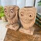 Pair of wooden "owl" candlesticks