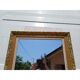 Wooden mirror and gold trim