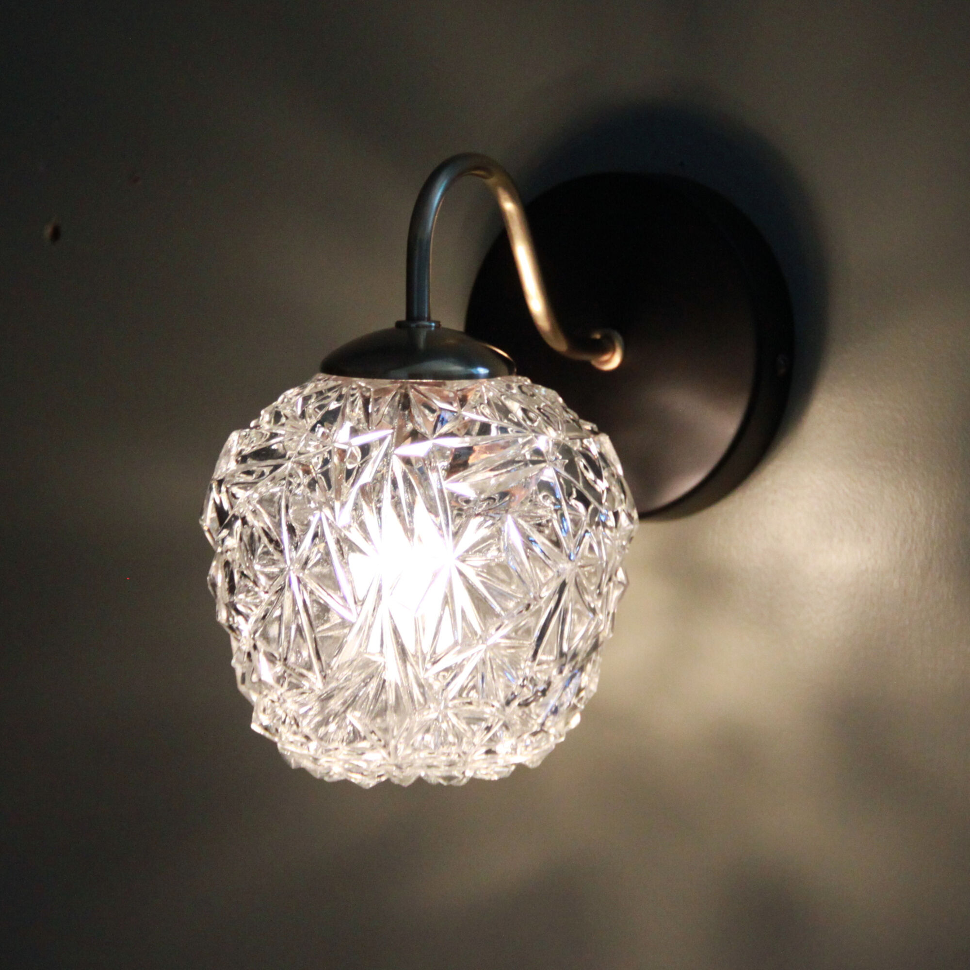 Pair of brass wall sconces and thick glass globe vintage luminaire