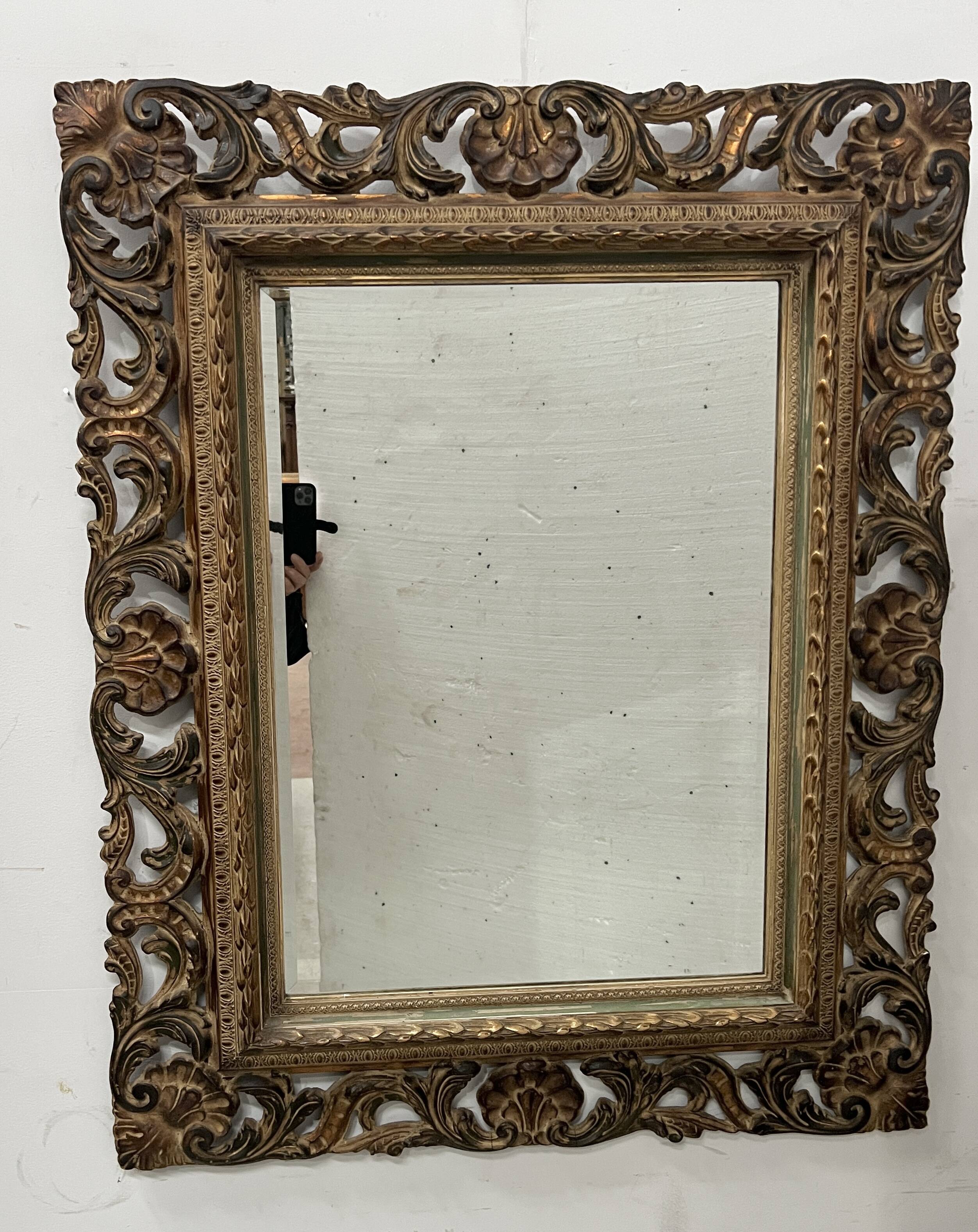 Napoleon III style mirror in carved wood, 20th century.