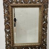 Napoleon III style mirror in carved wood, 20th century.