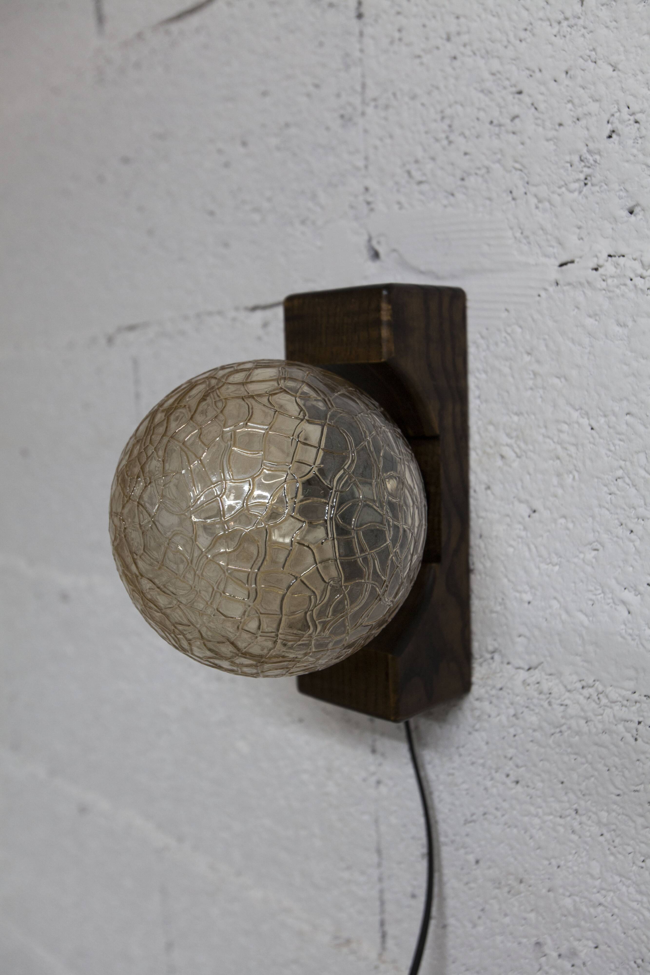 1960s ball wall light in dark wood and amber glass