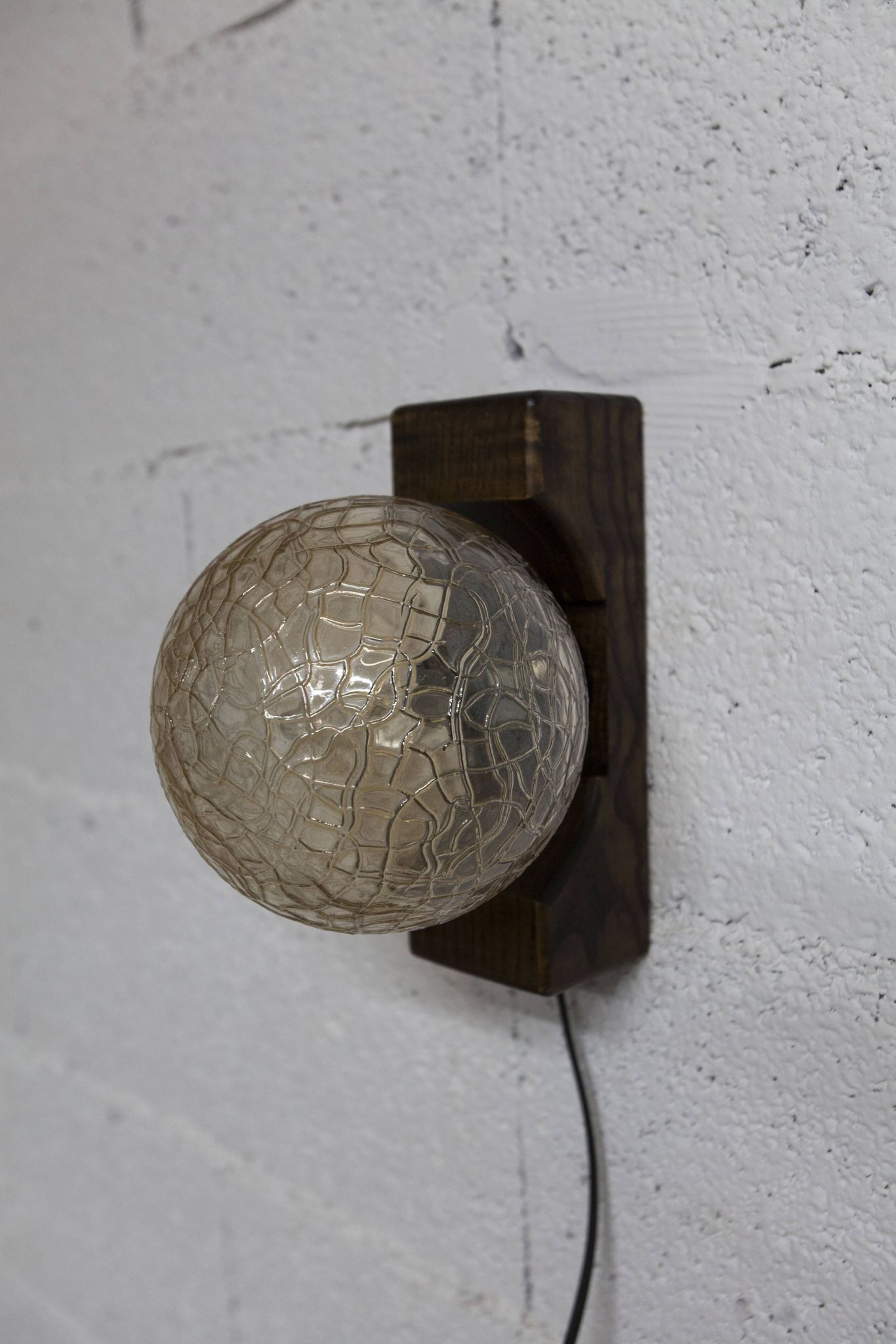 1960s ball wall light in dark wood and amber glass