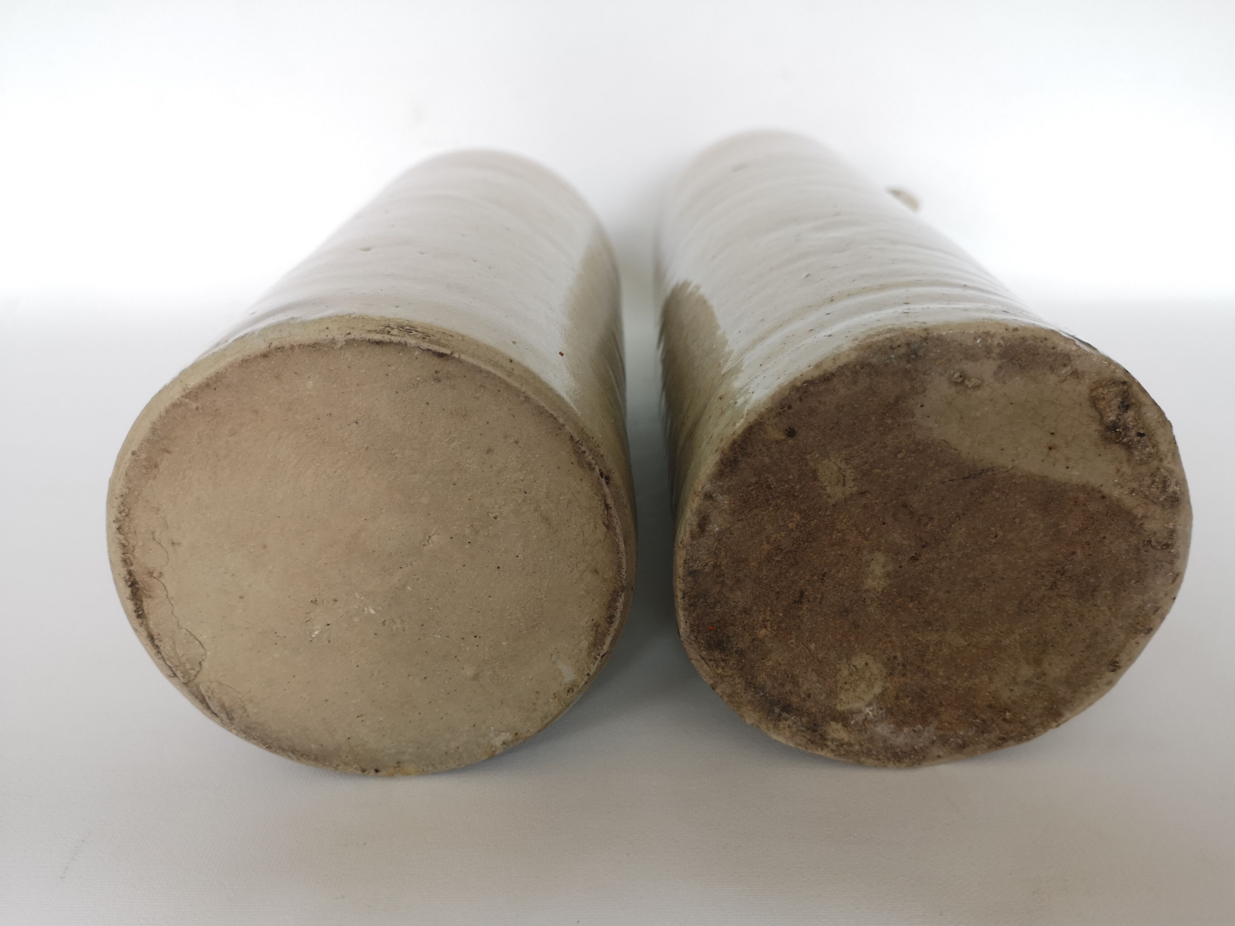 Pair of enamelled sandstone bottles