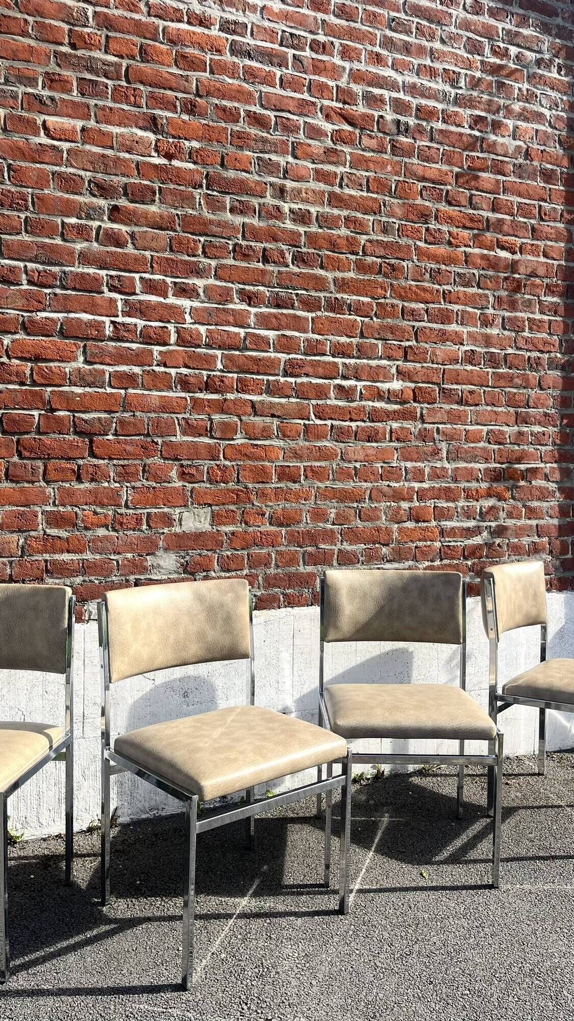 Set of 4 vintage chairs in chrome and faux leather.