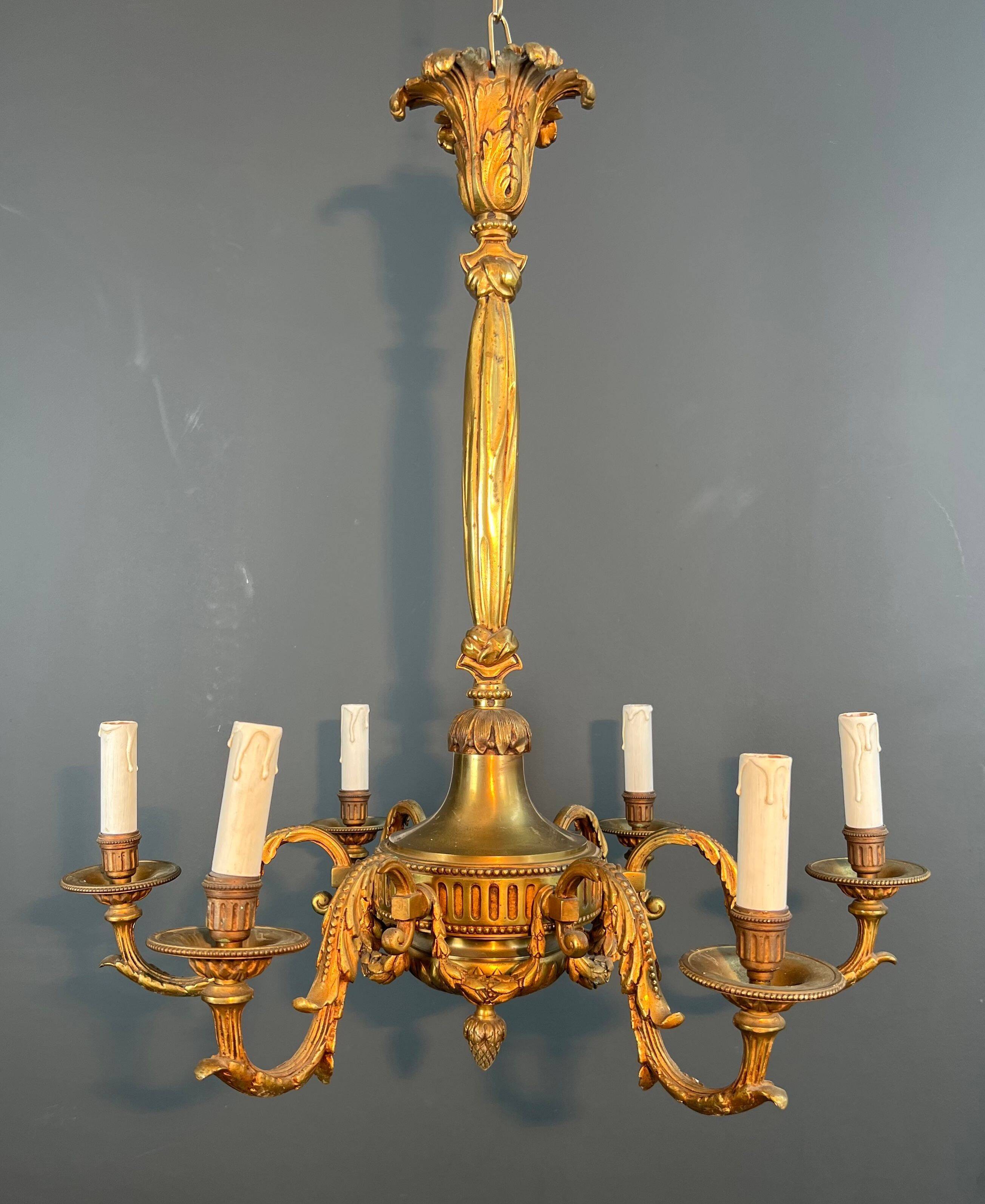 Lustre with 6 light arms in bronze in the Louis XVI style.