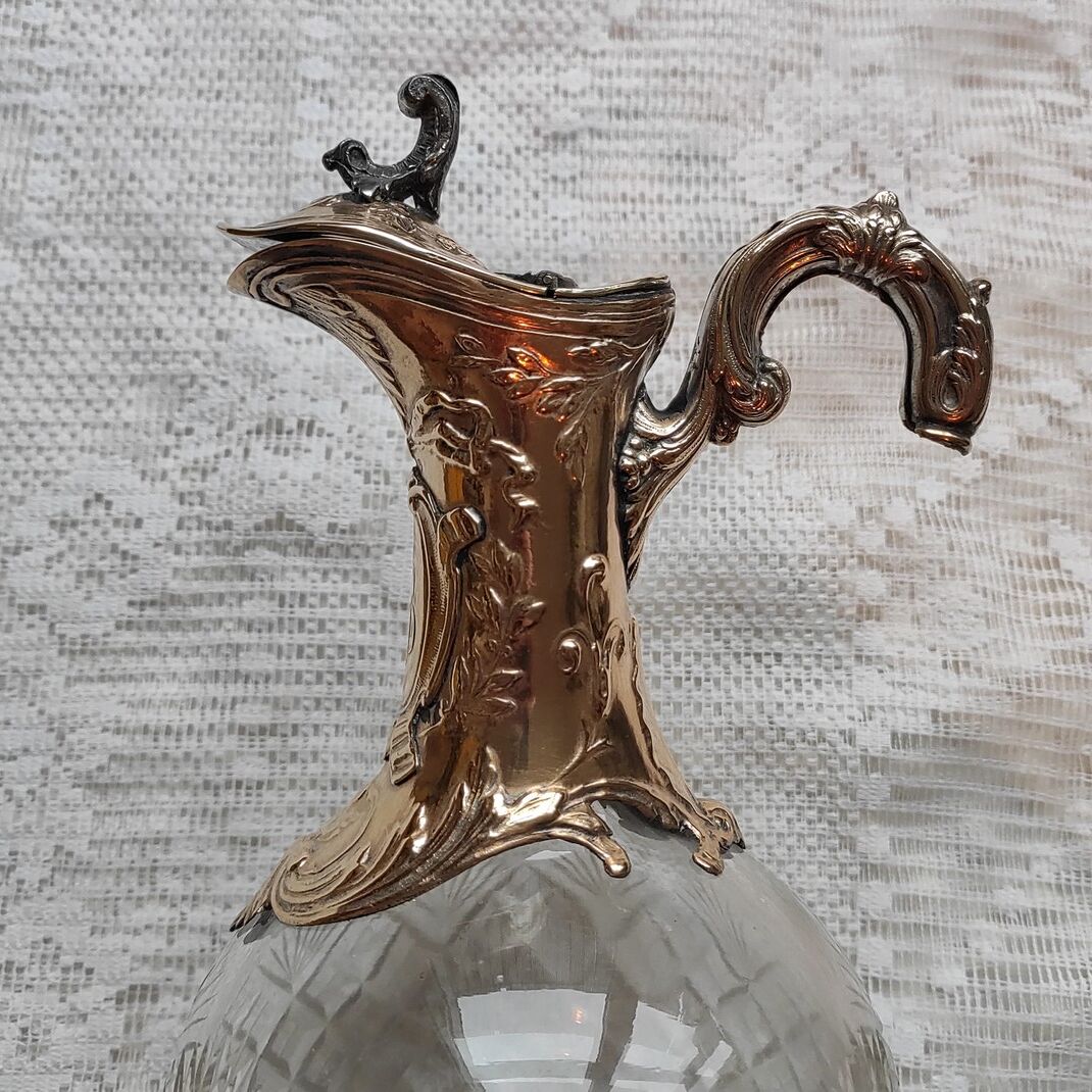 Cut crystal ewer and brass