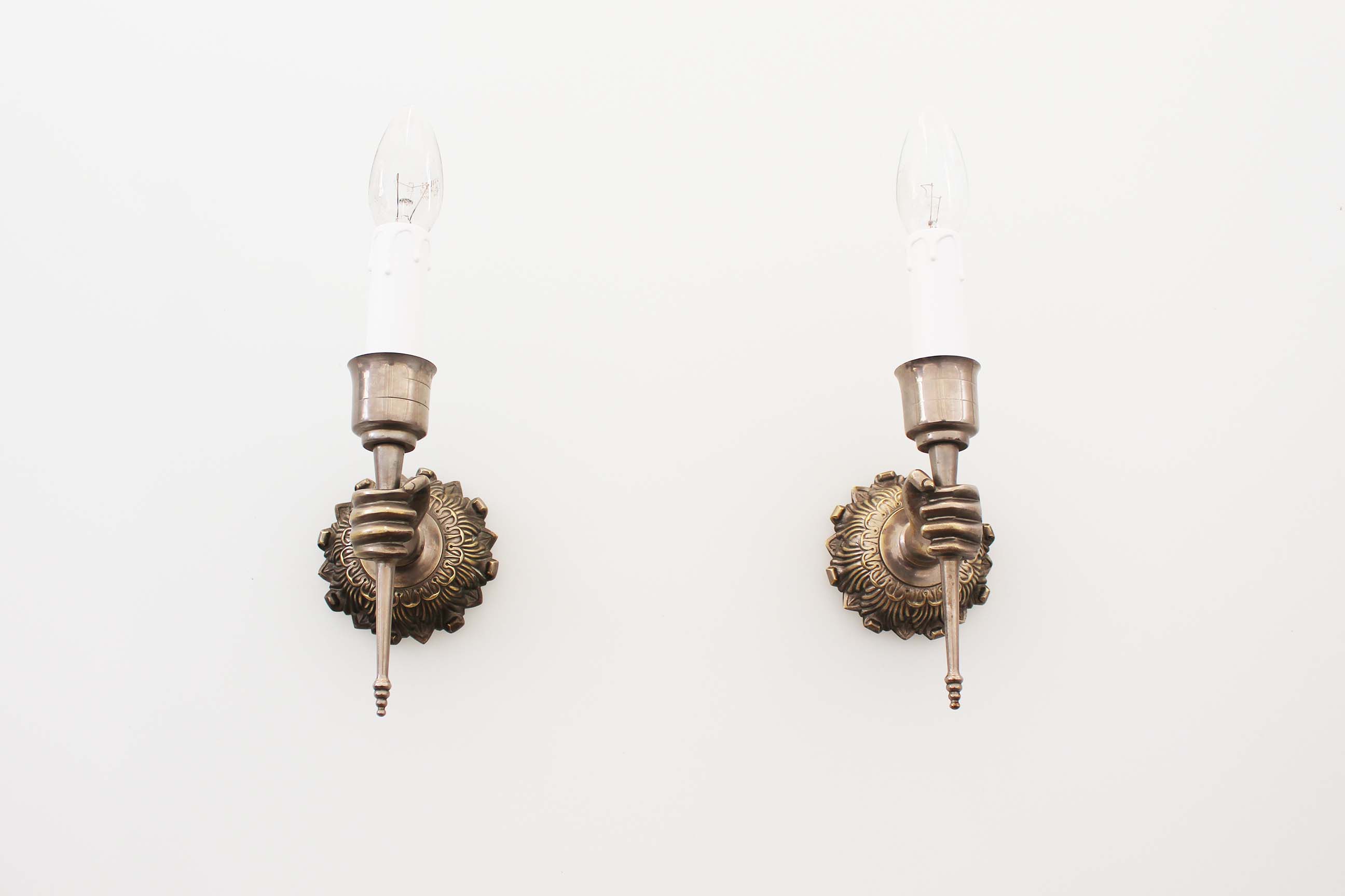 Pair of 1950’s solid metal ‘torch holding hand’ wall sconces by maison arlus