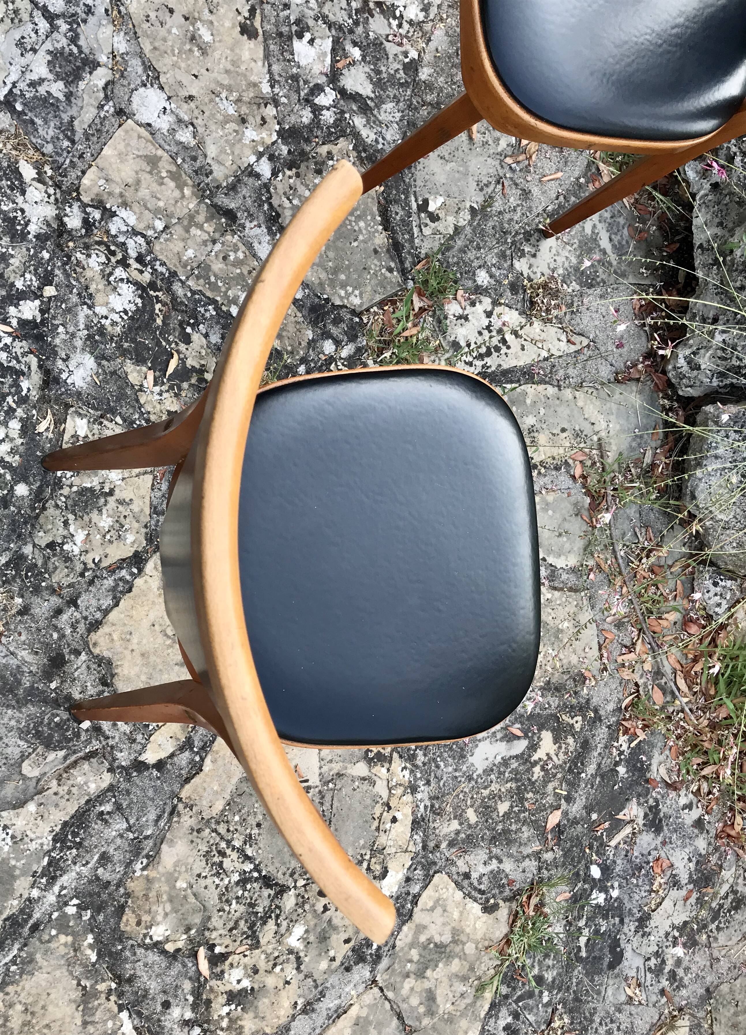 Four vintage beech and skai chairs