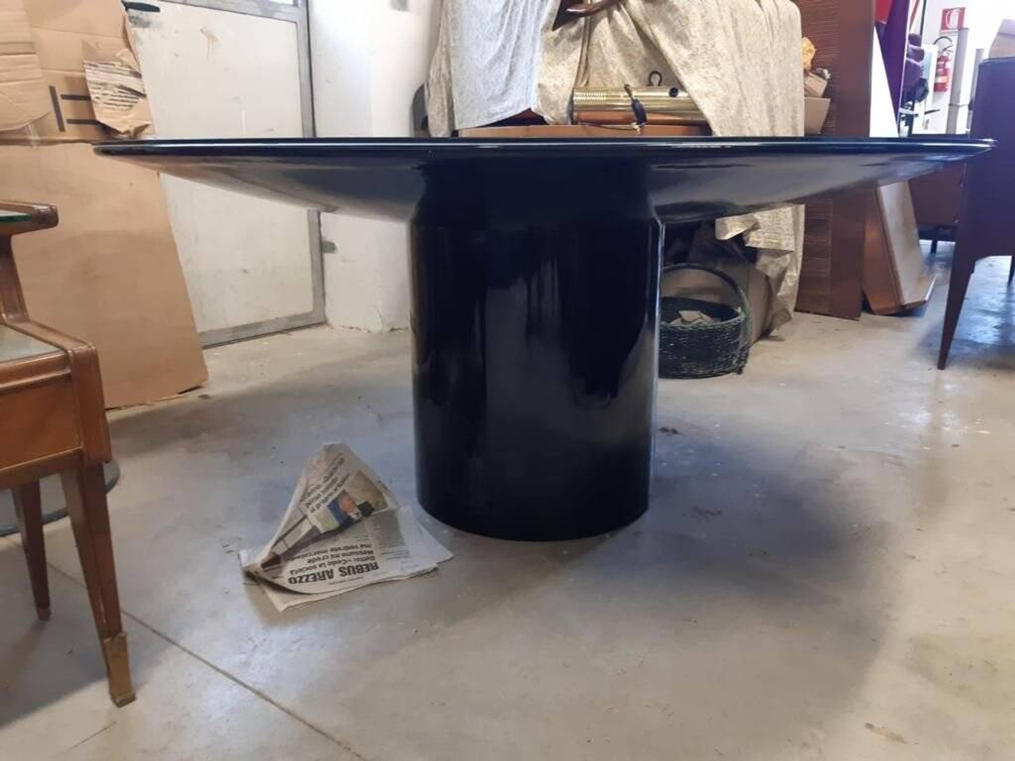 Black lacquered glass table and glass in the hoof style, Italy.