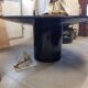 Black lacquered glass table and glass in the hoof style, Italy.